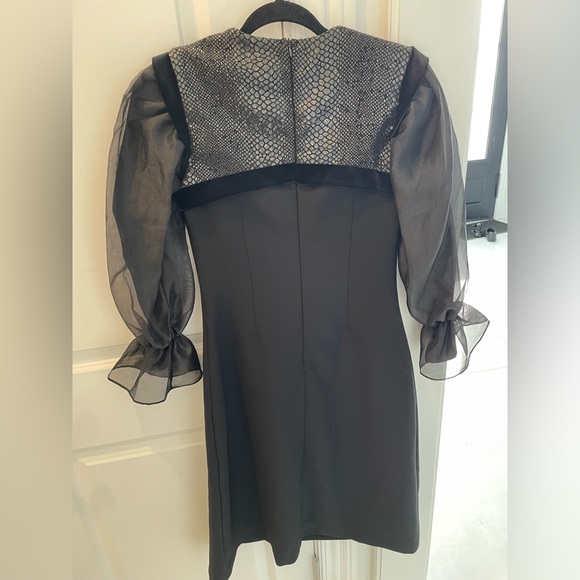 Shanis black long sleeve knee length dress. Poof detail at cuff. - Picture 2 of 6